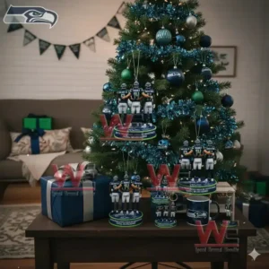 Never Underestimate a Woman Who Loves Football and the Seattle Seahawks Ornament 5 Alt text: A Seattle Seahawks-themed Christmas tree with team logo and football ornaments, accompanied by player figurines displayed on a table.