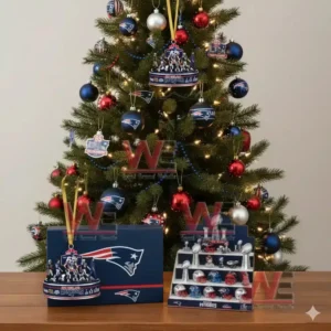 Alt text: A New England Patriots-themed Christmas tree with team ornaments, footballs, and player figurines displayed on a table.