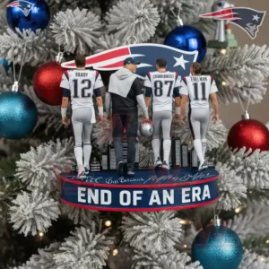 Four uniformed figures stand on a team themed ornament hanging from a snowy Christmas tree with red blue and silver baubles in the background!