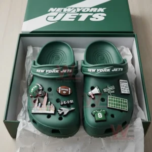 Green Jets clogs with themed charms inside an open Jets box!