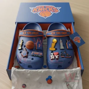 New York Knicks Crocs inside their packaging box, decorated with basketball-related charms.