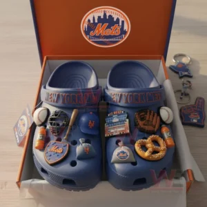 Blue New York Mets clogs with multiple themed charms arranged inside an open team box.