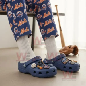 Blue New York Mets clogs with themed charms worn with white socks and Mets patterned pants.