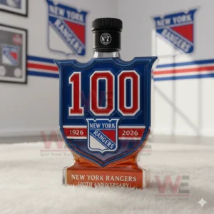 A black capped one hundred year New York Rangers bottle sits on a white rug with team banners in the background!