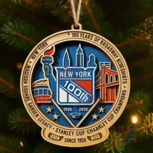 A wooden ornament featuring the New York Rangers 100th anniversary emblem with New York landmarks and hockey symbols hanging on a festive Christmas tree.