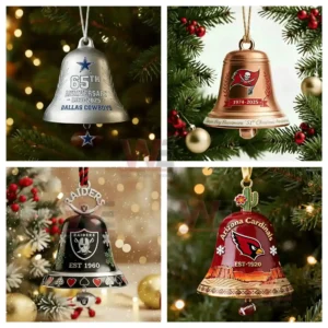 Four team themed Christmas bell ornaments are displayed on a decorated tree with soft glowing holiday lights.