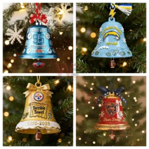 Four decorated team themed Christmas bell ornaments hang on a tree with bright holiday lighting.