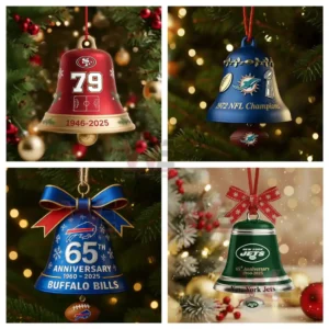 Four colorful team themed Christmas bell ornaments hang on a tree surrounded by warm holiday lights.