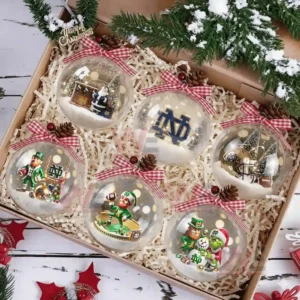 A set of six Notre Dame Fighting Irish Christmas ornaments featuring the logo, mascot in holiday attire, and football elements, all designed for the festive season.
