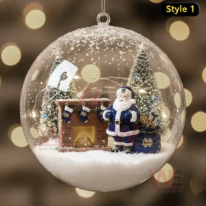 Notre Dame Fighting Irish Christmas Ornament 8 An ornament featuring Santa by the fireplace with Notre Dame stockings and snow-covered trees, capturing the holiday spirit.