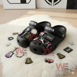 Oasis Crocs with Charms 6 Oasis themed Crocs on a white rug with music and British themed charms scattered around them.