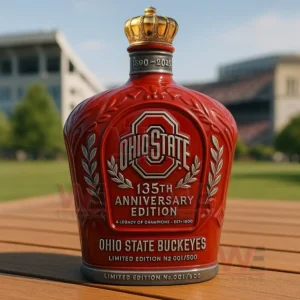 A red Ohio State bottle stands on a wooden surface outdoors with a stadium in the background!