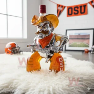 A cowboy shaped bottle filled with orange liquid sits on a white rug with OSU sports decor behind it!
