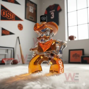 OSU Oklahoma State Cowboys Whiskey Bottle 10 A cowboy shaped bottle with orange liquid is placed on a white rug with OSU jerseys banners and sports gear in the background!