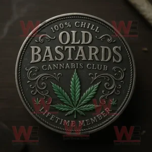 A dark metallic coin with ornate designs featuring the words Old Bastards Cannabis Club and a green cannabis leaf in the middle.