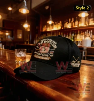 Old Bastards Golf Club Lifetime Member Cap hat 12 Black Old Bastards Golf Club cap on wooden bar counter with whiskey glass.