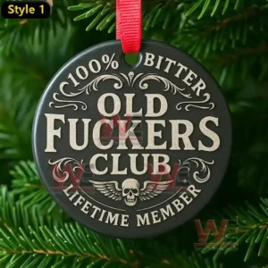 A dark round ornament with engraved club themed text and a winged skull hanging from a red ribbon on a pine tree!