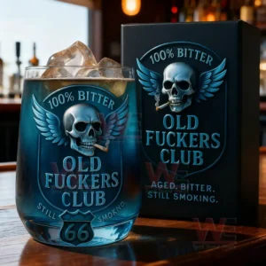 Old Fuckers Club whiskey glass with gold skull emblem and Route 66 themed background.