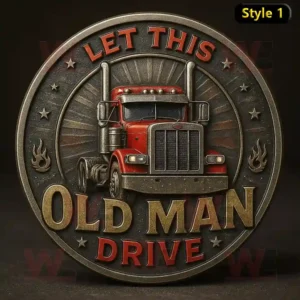 Circular metal badge with red truck and text Let This Old Man Drive surrounded by stars and flames!