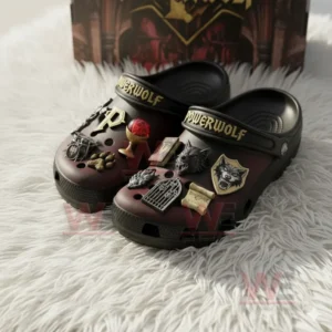 Dark Powerwolf clogs with multiple gothic themed charms displayed on a fluffy white background!
