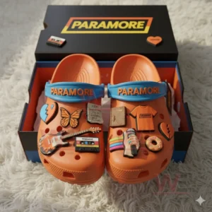 Paramore Crocs with Charms 6 Orange Paramore Crocs with music themed charms displayed inside a matching branded box!
