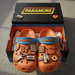 Paramore Crocs with Charms 7 Orange Paramore Crocs with band inspired charms in an open colorful box on the floor!