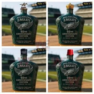 Four Eagles anniversary bottles with different toppers stand on a surface overlooking a football stadium.
