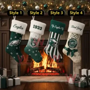 Alt text: Four Christmas stockings with Philadelphia Eagles designs hanging over a fireplace with gifts below.