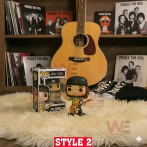 Pierce The Veil Pop Figure Vinyl 7 A Vic Fuentes vinyl figure with an orange guitar displayed in front of music albums and a guitar.