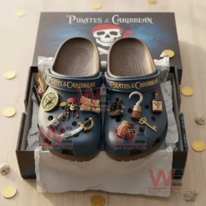 Alt text: Pirates of the Caribbean Crocs clogs with charms in a box, featuring pirate-themed packaging and accessories.