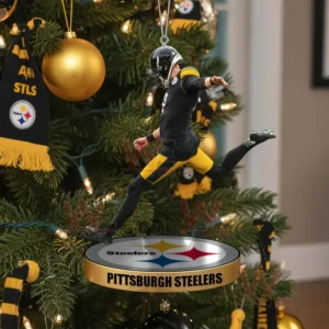 Pittsburgh Steelers football kicker ornament hanging on a Christmas tree with team themed decorations.