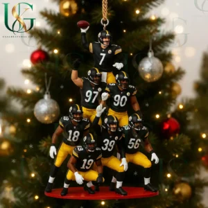 Football themed Christmas ornament showing players in black and yellow uniforms stacked in a pyramid pose with a decorated tree behind them!