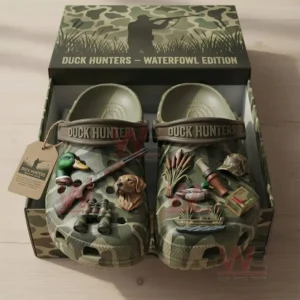 Camo clogs in a box with duck hunting themed charms and decorations.