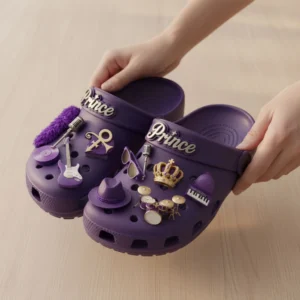 Prince Crocs Clogs with Charms 7 Hands holding purple Prince themed Crocs with detailed charms.