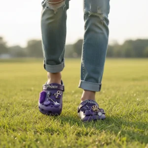Prince Crocs Clogs with Charms 8 Purple Prince themed Crocs worn outdoors on green grass.