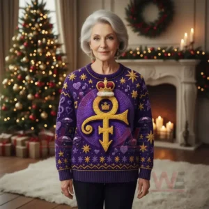 Prince Rogers Nelson Christmas Sweater 7 Woman wearing a purple Christmas sweater with golden design standing near a Christmas tree and fireplace!