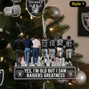 A Christmas ornament displaying several Raiders legends standing on a decorated stand with festive tree ornaments behind them!