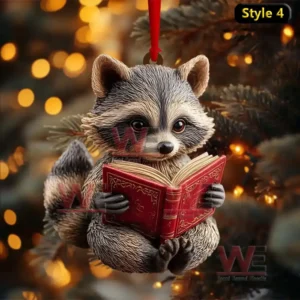 Raccoon Christmas ornament reading a red book hanging from a tree with warm holiday lights!