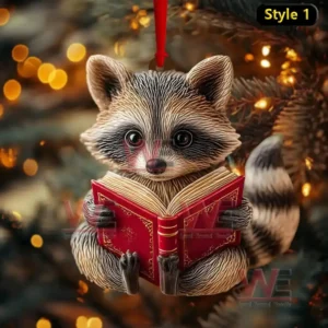 Christmas ornament of raccoon reading a red book hanging on tree with golden lights!