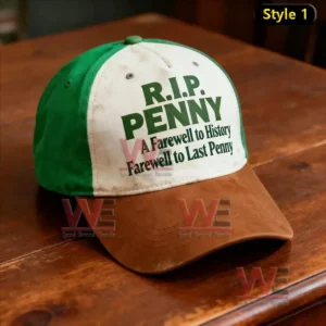 Green and brown cap with R I P Penny text resting on a wooden table!