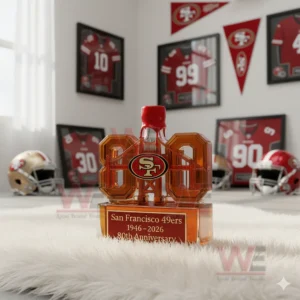 San Francisco 49ers 1946-2026 80th Anniversary Limited Edition Whiskey Bottle 9 A red capped eighty shaped 49ers anniversary bottle sits on a white rug among team decor!