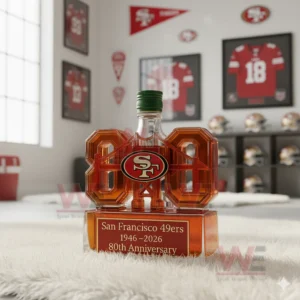 San Francisco 49ers 1946-2026 80th Anniversary Limited Edition Whiskey Bottle 11 A green capped eighty shaped 49ers bottle sits on a white rug surrounded by football decor!
