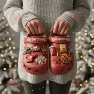 San Francisco 49ers Crocs with charms held in front of a snowy festive background!