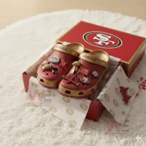 Red and gold 49ers Crocs with team charms inside matching box on white surface!
