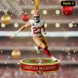 Alt text: Christian McCaffrey running with the football on a Christmas ornament, set against a festive stadium backdrop.