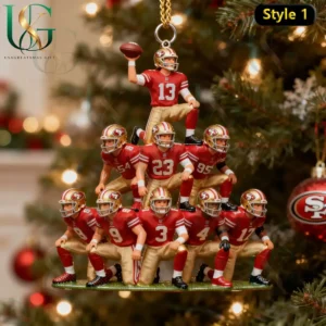 San Francisco 49ers football players in a pyramid formation as a Christmas tree ornament with a decorated tree in the background!