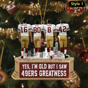 A Christmas ornament displaying four San Francisco 49ers legends positioned on a decorated base with holiday tree ornaments behind them!