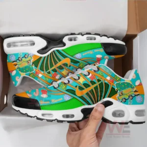 A pair of Scooby-Doo Christmas-themed sneakers in a shoe box with vibrant Christmas graphics.