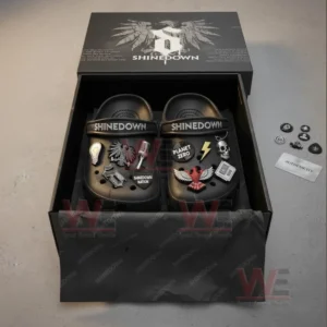 Black Shinedown clogs with themed charms placed inside a sleek black box with logo details.