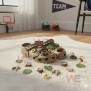 Premium sloth-themed Crocs with charms and decorations on a soft surface in a room.